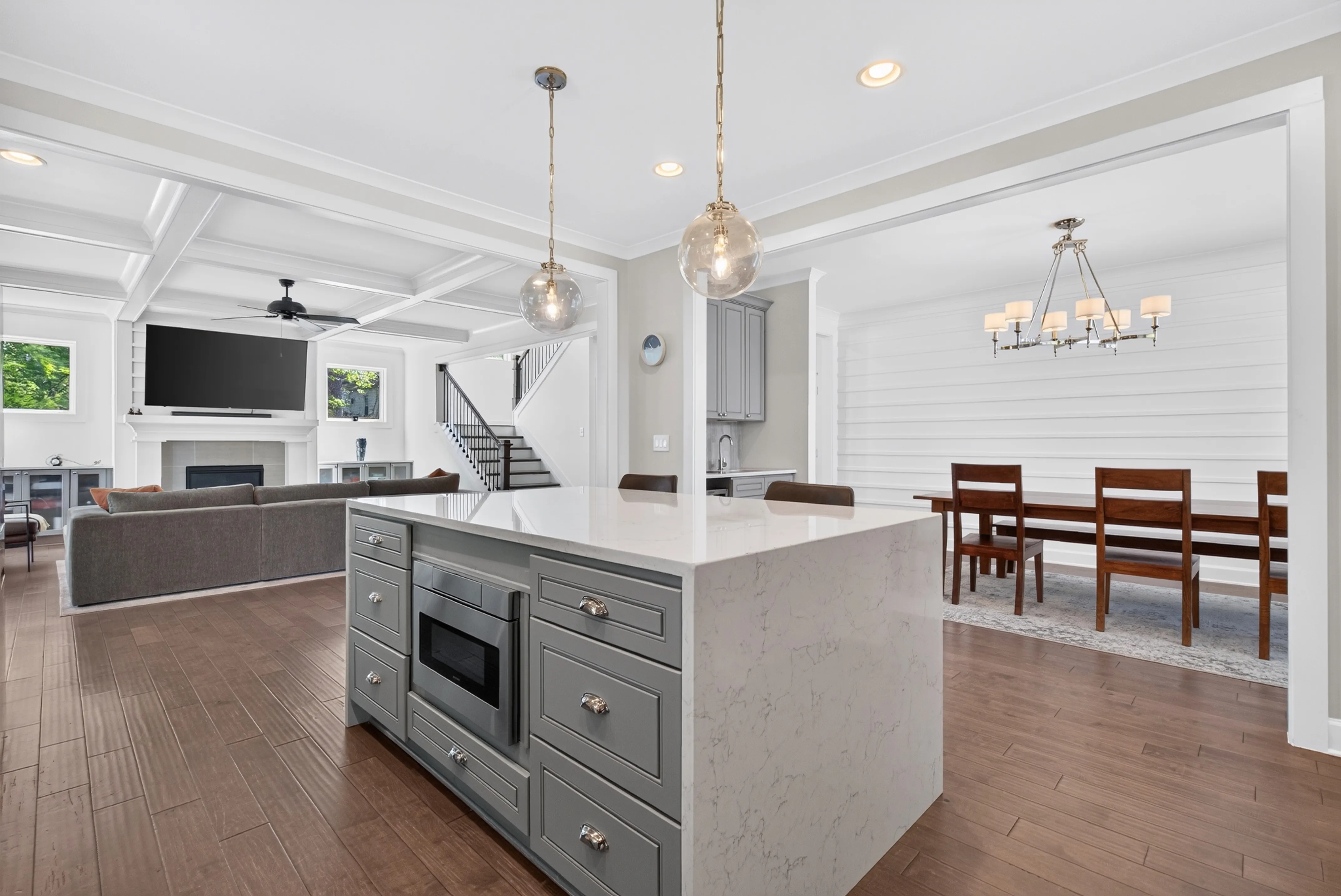 Open kitchen and living room with a large gray island