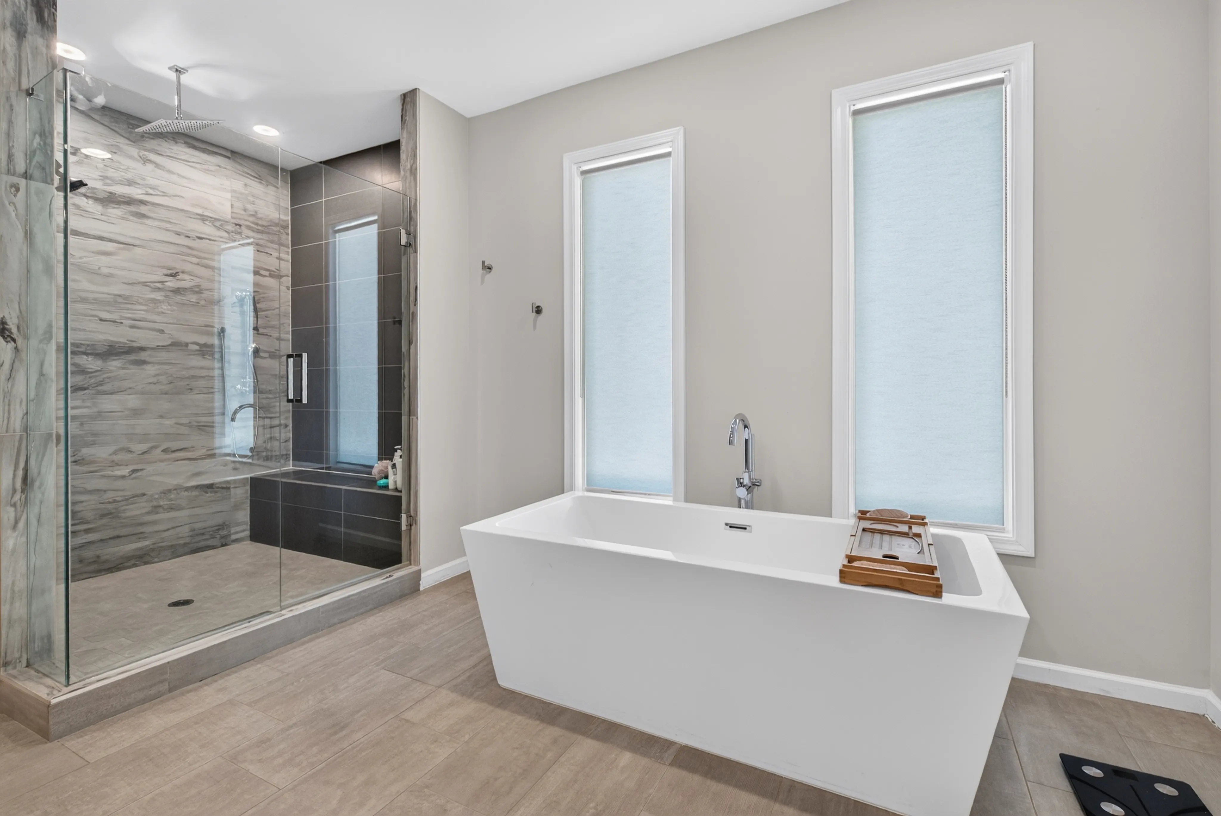 Bathroom with a freestanding soaking tub and tiled walk-in shower
