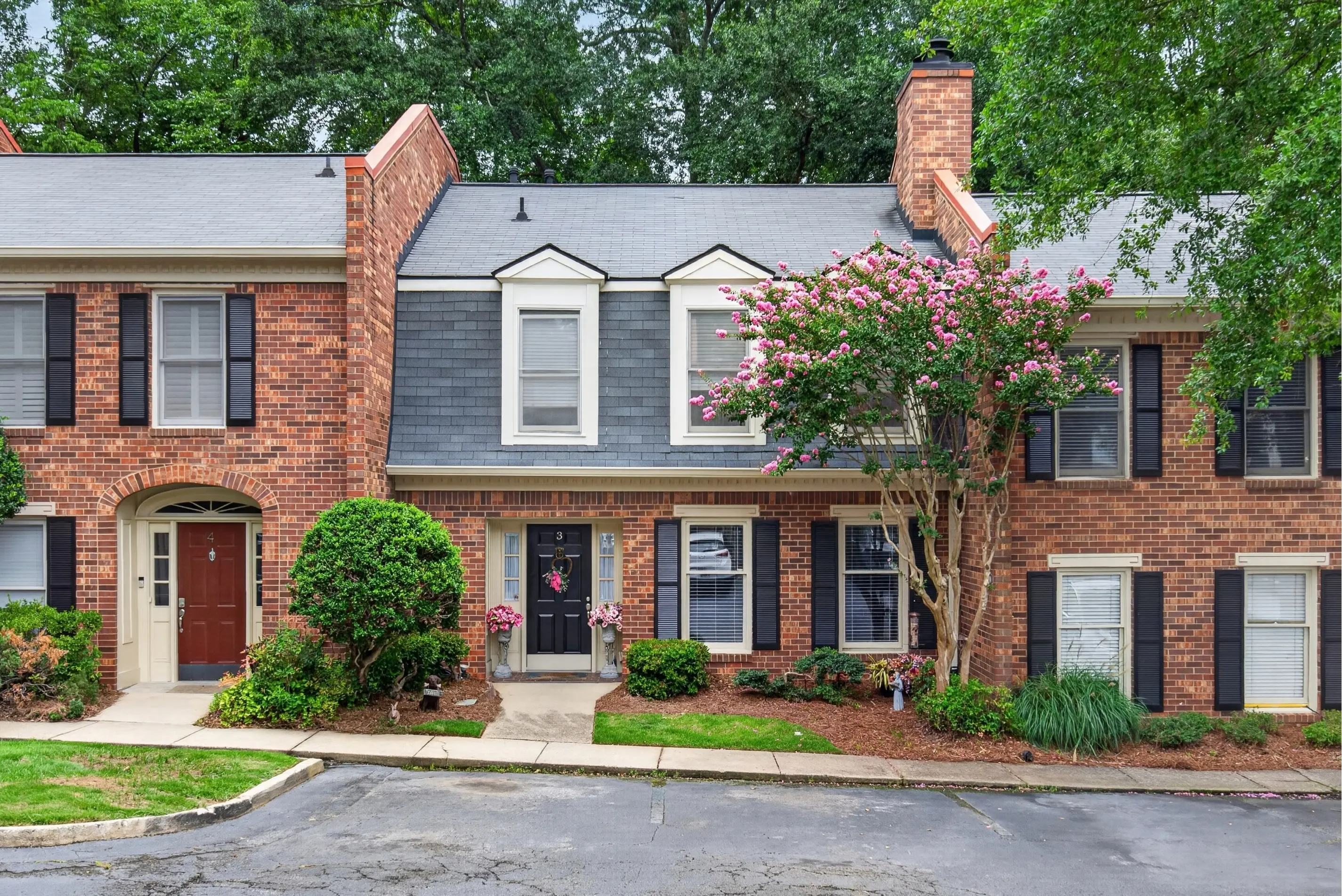 Brick townhomes with landscaped entrances