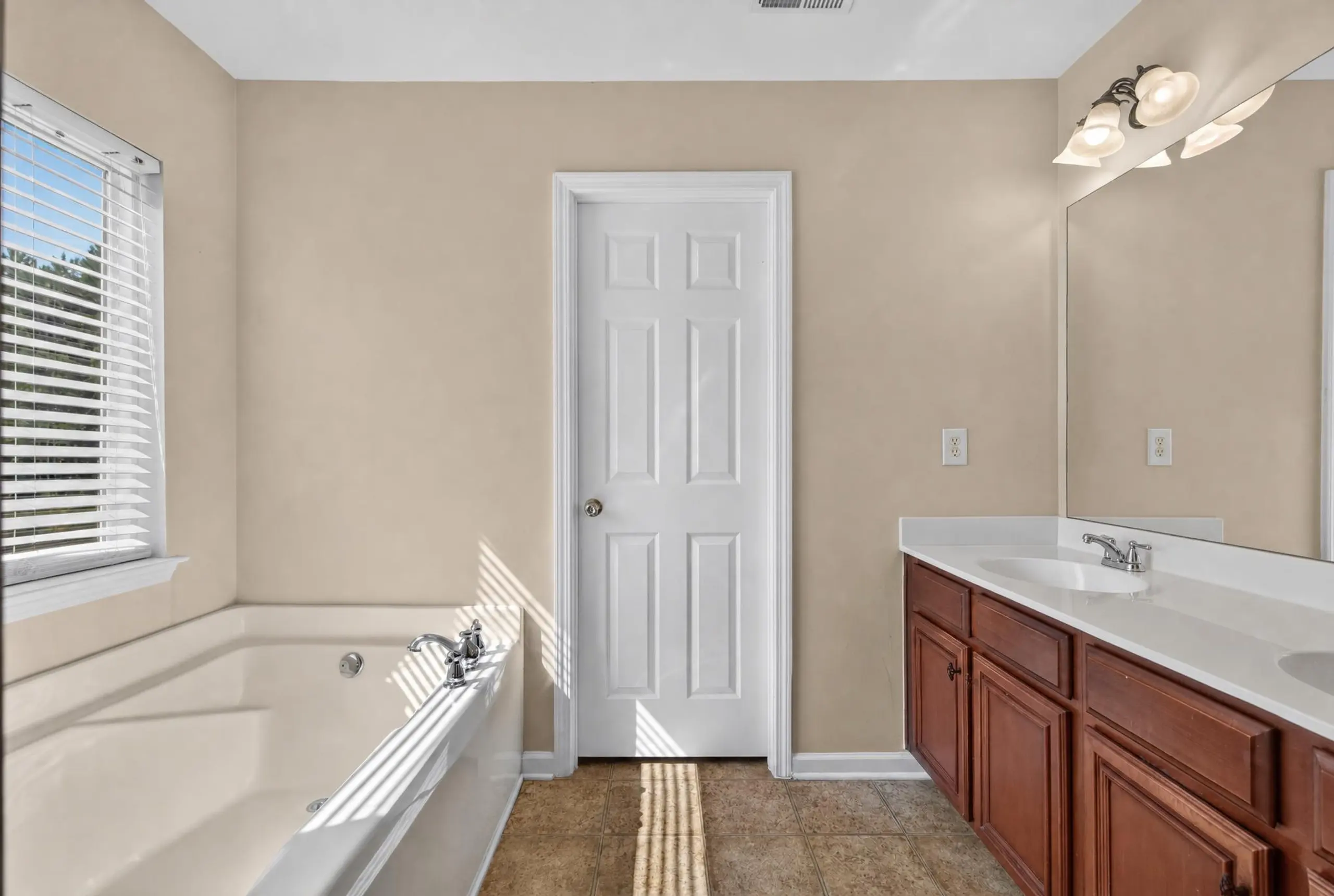 Primary bath with a garden tub and double vanity